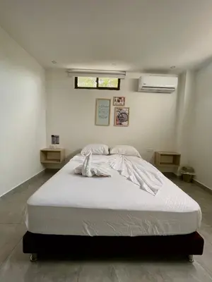 a bedroom with a large white bed in a room at Hotel La Estrella de David Cartagena in Cartagena de Indias