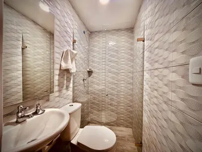 a bathroom with a toilet and a sink and a shower at Hotel La Estrella de David Cartagena in Cartagena de Indias
