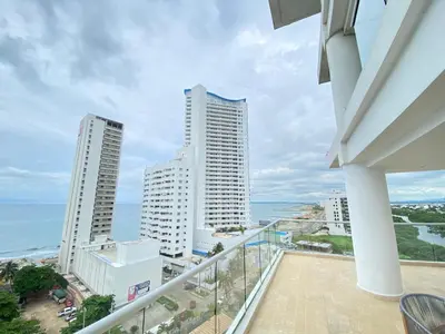 a balcony with a view of the ocean and buildings at Melodias de Verano in Cartagena de Indias