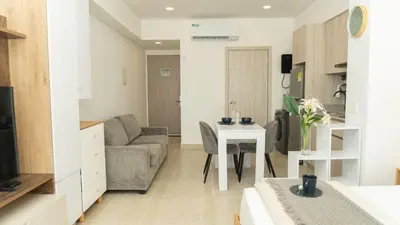 a living room with a couch and a table at CB 1002 | Suite moderna con vista al mar infinita in Cartagena de Indias