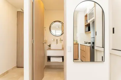 a bathroom with a sink and a mirror at Comoda Suite Vista al lago-Amanecer hermoso CB1130 in Cartagena de Indias
