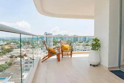 a living room with a view of a city at Comoda Suite Vista al lago-Amanecer hermoso CB1130 in Cartagena de Indias
