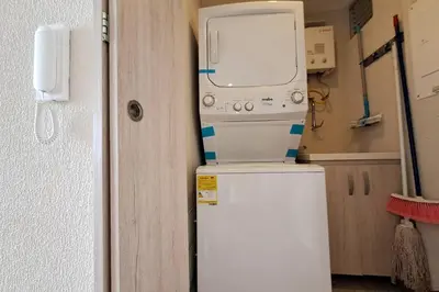 a microwave sitting on top of a refrigerator at Piscinas con vista increible, bar, música y playa in Cartagena de Indias