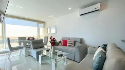a living room with a couch and a table at Apartamento de una habitacion Palmetto Sunset 1703 in Cartagena de Indias