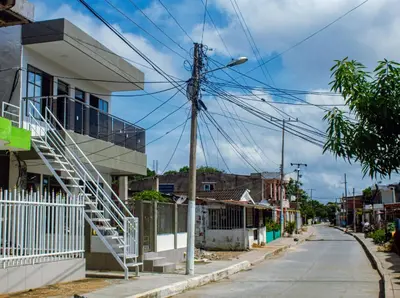 an empty street in a small town with a white house at Charles gomez in Cartagena de Indias
