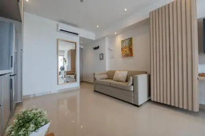 a living room with a couch and a chair at CB1531 | Confort premium: cama King y balcón in Cartagena de Indias