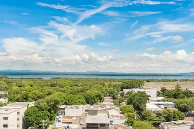 an aerial view of a city and a lake at Apartamento ideal para familias y trabajo CB931 in Cartagena de Indias