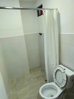 a bathroom with a toilet with a shower curtain at Apartaestudios la terraza 1 in Sincelejo