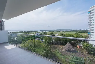 an empty balcony with a view of a city at 2BD Next to Beach W Pvt Jacuzzi Martinique 74 in Cartagena de Indias