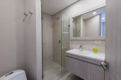 a bathroom with a sink and a shower with a mirror at 2BD Next to Beach W Pvt Jacuzzi Martinique 74 in Cartagena de Indias