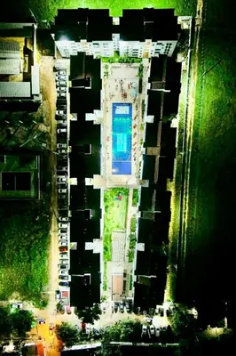 an aerial view of a parking lot with a pool at Caribe campestre coveñas in Coveñas