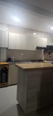a kitchen with a wooden counter top in a kitchen at Caribe campestre coveñas in Coveñas