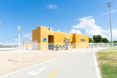 a yellow building with the word omega on it at CB726 | Suite moderna frente al mar con balcón y cocina con isla in Cartagena de Indias