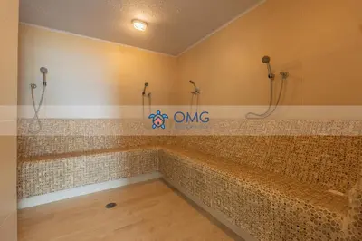 a bathroom with a large tub with tiles on the wall at Suite frente al mar + piscina + balcón privado 727 in Cartagena de Indias
