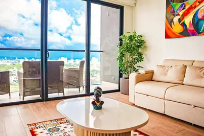 a living room with a couch and a table at Dizztravel Apart Murano Centro Exclusivo apto 2701 in Cartagena de Indias