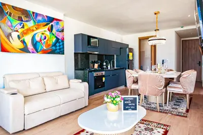 a living room with a white couch and a table at Dizztravel Apart Murano Centro Exclusivo apto 2701 in Cartagena de Indias