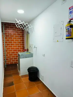 a room with a brick wall and a brick wall at Apartaestudios la terraza 2 in Sincelejo