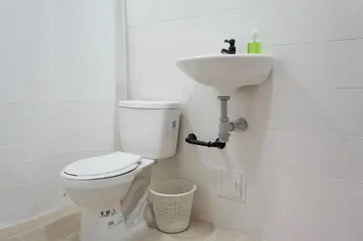 a bathroom with a toilet and a sink at Apartaestudios la terraza 2 in Sincelejo