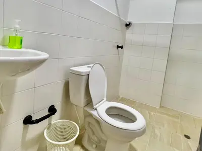 a bathroom with a toilet and a sink at Apartaestudios la terraza 3 in Sincelejo