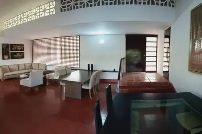 a living room with a table and a couch at campestre, naturaleza, confort, familiar in Turbaco