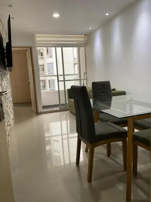 a dining room with a glass table and chairs at Apto para vacaciones en familia in Cartagena de Indias