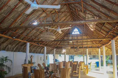 a room with a table and chairs in a building at Ledymar Chalet in Cartagena de Indias