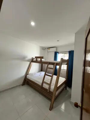 a bedroom with a bunk bed in a room at Apartamentos Mila in Guayabal