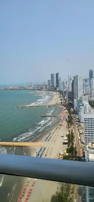a view of a beach with buildings and the ocean at Lujo frente a la playa in Cartagena de Indias