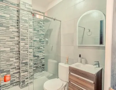a bathroom with a toilet and a sink and a shower at Apartamentos el mochilero frente a la playa piso 1 apto 2 in Cartagena de Indias