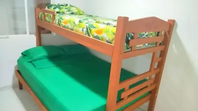 a bunk bed in a room with a green mattress at Hospedaje Doña Argenida in Cartagena de Indias