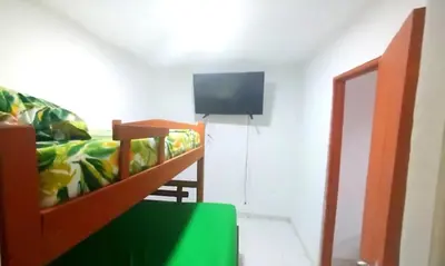 a living room with a couch and a tv at Hospedaje Doña Argenida in Cartagena de Indias