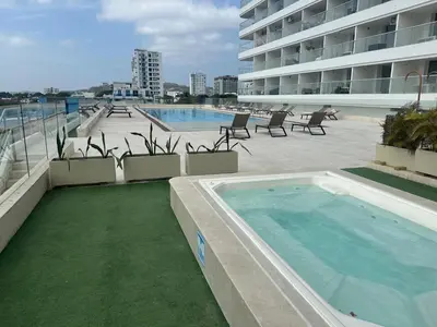 a swimming pool on the side of a building at Aparta suite Fantástique in Cartagena de Indias