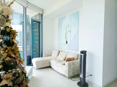 a living room with a christmas tree and a couch at Apartamento VIP - Con vistas al Mar y Playa in Santa Marta