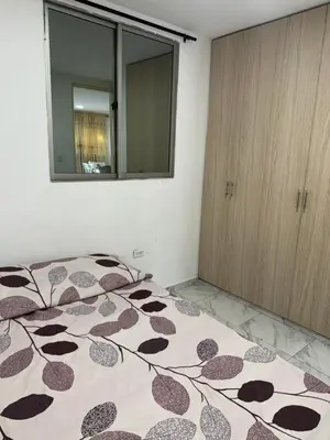a bedroom with a bed with a cow pattern on it at Rincón sereno barranquilla in Barranquilla