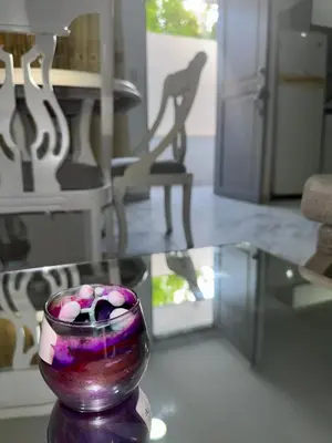 a glass vase sitting on a table in a room at Rincón sereno barranquilla in Barranquilla