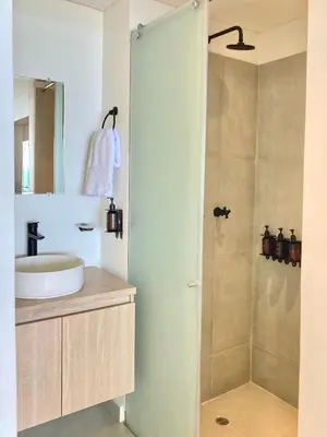 a bathroom with a sink and a shower at Suite moderna con vista al mar y parque CB 814 in Cartagena de Indias