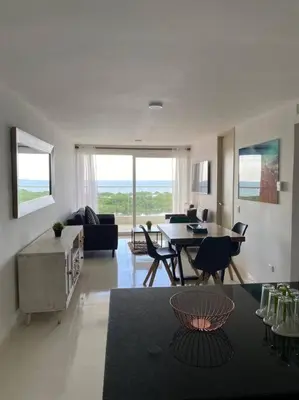 a large living room with a table and chairs at Mirador del Mar Playa Mendoza in Tubará