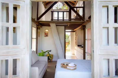a living room with a couch and a table at Tiny Village Cartagena Boutique Resort in Tierra Bomba