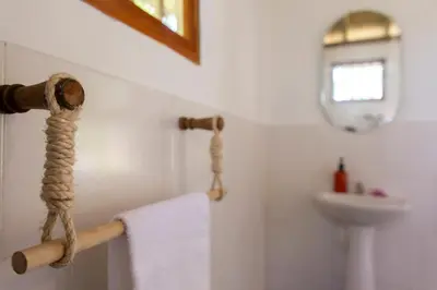 a towel hanging on a towel rack in a bathroom at Tiny Village Cartagena Boutique Resort in Tierra Bomba