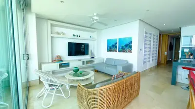 a living room with a couch and a table at Magico Apartamento Frente al Mar 3 Habitaciones TR51 in Coveñas