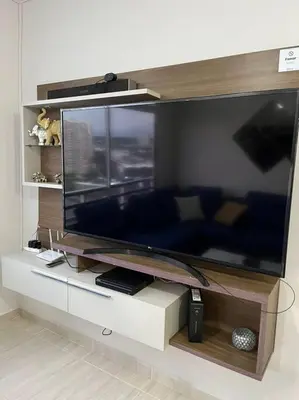a large entertainment center with a large flat screen tv at Barranquilla Villa Campestre Malecon Rio Uninorte in Barranquilla