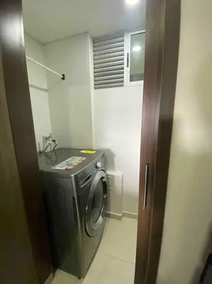 a small bathroom with a washing machine in it at Barranquilla Villa Campestre Malecon Rio Uninorte in Barranquilla