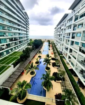 an aerial view of a beach with palm trees and buildings at Ocean Luxe Morros in Cartagena de Indias