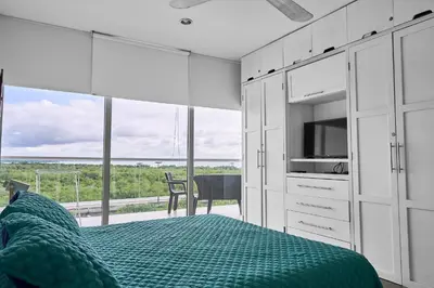 a bedroom with a bed and a view of the ocean at Ocean Luxe Morros in Cartagena de Indias