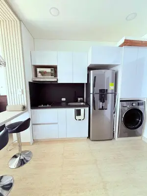 a kitchen with a stainless steel refrigerator and a dishwasher at Apartamento con vista al mar in Cartagena de Indias