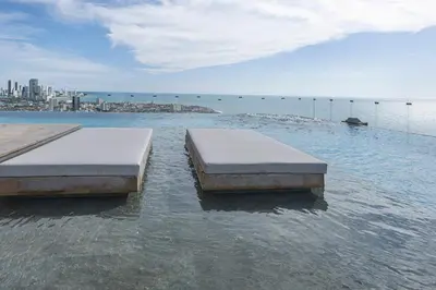 two beds sitting on top of a body of water at Cabrero Centro Tropical - Con vista al mar in Cartagena de Indias