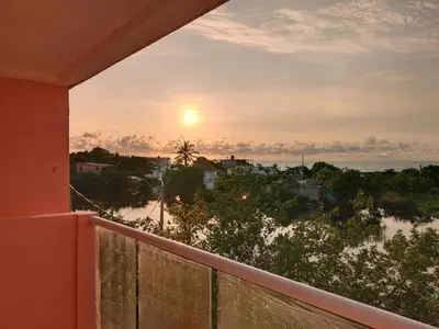 a view of a sunset from a balcony at Hotel Casa Harmony Cartagena in Cartagena de Indias
