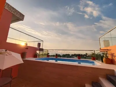 a villa with a swimming pool and a patio at Hotel Casa Harmony Cartagena in Cartagena de Indias