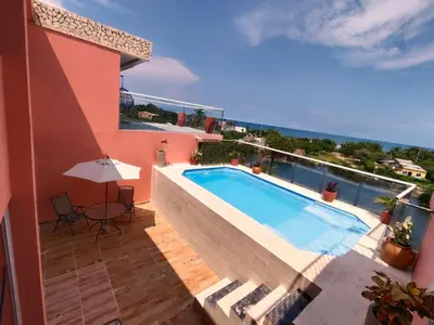 a swimming pool on the balcony of a house at Hotel Casa Harmony Cartagena in Cartagena de Indias