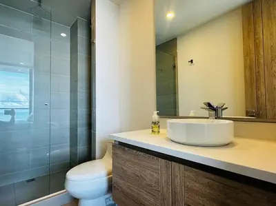 a bathroom with a sink and a toilet at Mágico Apartamento - Vista Infinita al Mar in Cartagena de Indias